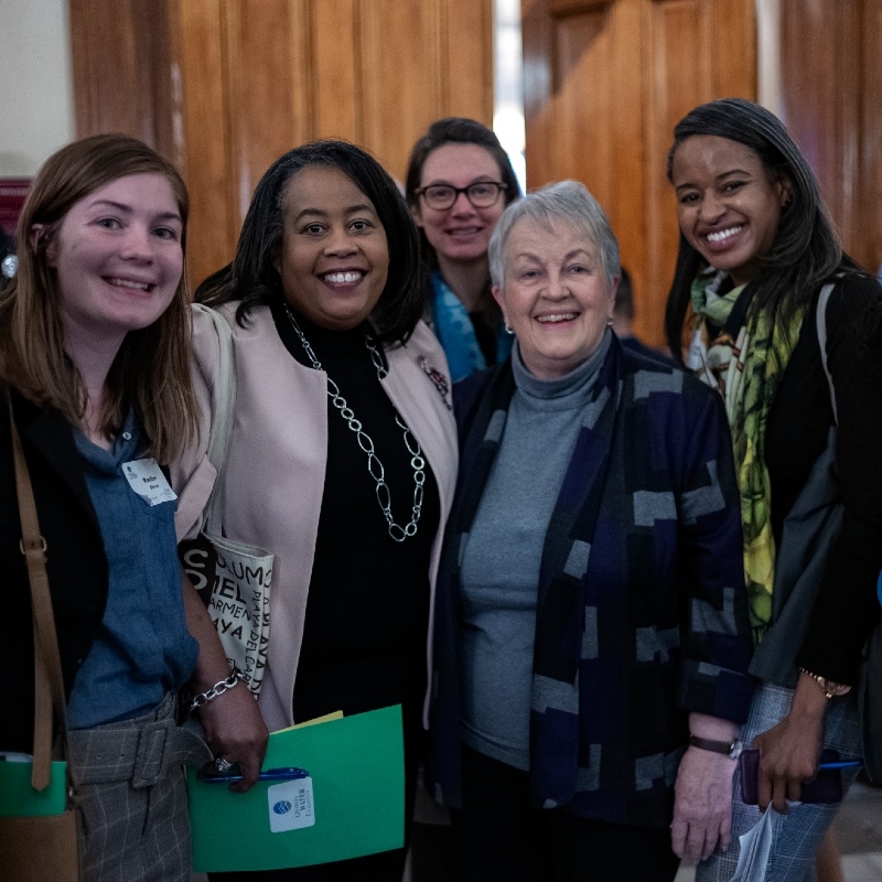 a smiling group of ladies